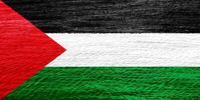 Flag of State of Palestine on a textured background. Concept collage. photo