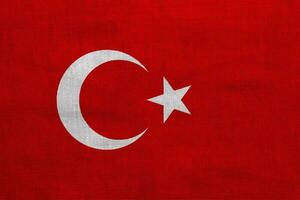bandera de Turquía en un texturizado antecedentes. concepto collage. foto