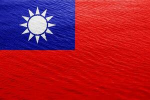 Flag of Republic of China Taiwan on a textured background. Concept collage. photo