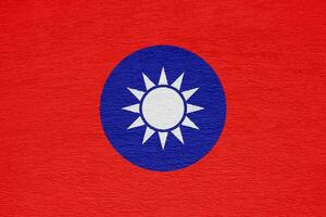 Flag of Republic of China Taiwan on a textured background. Concept collage. photo