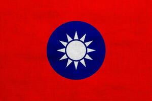 Flag of Republic of China Taiwan on a textured background. Concept collage. photo