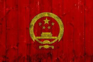 Flag and coat of arms of the People's Republic of China on a textured background. Concept collage. photo