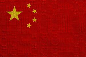 Flag of the People's Republic of China on a textured background. Concept collage. photo
