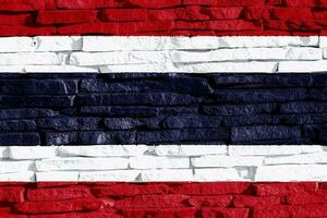 Flag of the Kingdom of Thailand on a textured background. Concept collage. photo