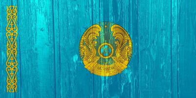 Flag of and coat of arms Republic of Kazakhstan on a textured background. Concept collage. photo