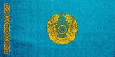 Flag of and coat of arms Republic of Kazakhstan on a textured background. Concept collage. photo