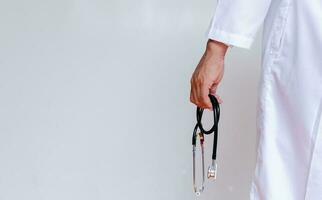 Doctor in lab coat on white background photo