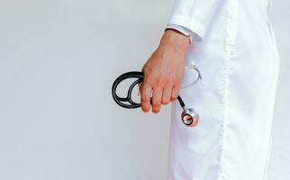 Doctor in lab coat on white background photo