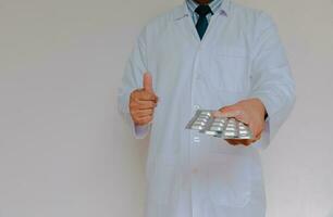 Doctor in lab coat on white background photo