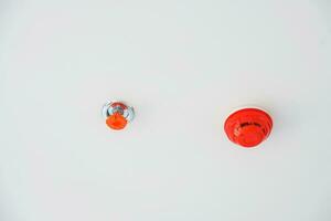 New Fire Sprinkler and Smoke sensor detector mounted on roof in home or apartment photo