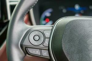 controlling steering wheel in electric modern automobile. Technology, Journey, trip and safety Transportation concepts photo