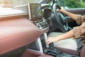 woman driver stick shift transmission a car gear, hand controlling steering wheel during vehicle moving. Journey, trip and safety Transportation concepts photo