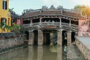 Japanese covered bridge or Cau temple in Hoi An ancient town, Vietnam. landmark and popular for tourist attractions. Vietnam and Southeast Asia travel concept photo