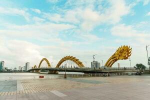 Dragon bridge with Han river in Da Nang city. Landmark and popular for tourist attraction. Vietnam and Southeast Asia travel concept photo