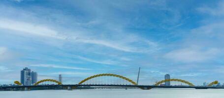 Dragon bridge with Han river in Da Nang city. Landmark and popular for tourist attraction. Vietnam and Southeast Asia travel concept photo