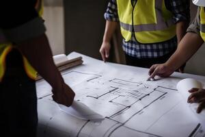 Architects working on blueprint at construction site. Engineering concept. construction workers dancing with blueprint, photo