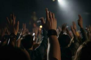 The crowd at a concert in front of the stage with hands raised up, Peoples closeup rear view raising their hands, AI Generated photo