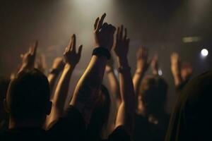 The crowd at a concert, hands raised up in the air. Peoples closeup rear view raising their hands, AI Generated photo