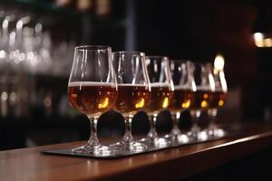Glasses with different types of beer on bar counter, closeup, Stylish beer glasses full of beer on the bar stand, photo