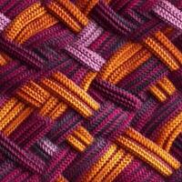 Fabric knitted seamless pattern with geometric shape spots. bright colors background for knitwear design or print, modern strips mat, illustration photo
