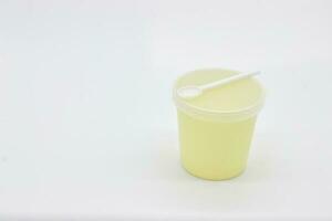 Stool test container with scoop on white background photo