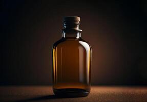 Brown bottle of oil on dark background. photo