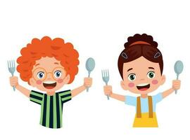 Cartoon happy little boy holding a spoon and fork vector