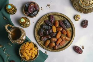 Eid al-Fitr holiday concept with sweet dried dates, fruits and decorations on bright background. Top view from above, generate ai photo