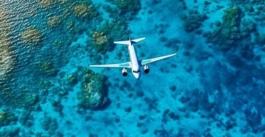 Top down view of white plane flying over blue sea, ocean, travel, vacation concept - AI generated image photo