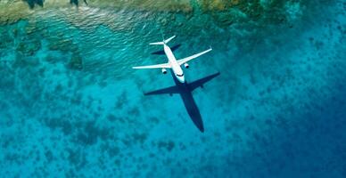 Top down view of white plane flying over blue sea, ocean, travel, vacation concept - AI generated image photo