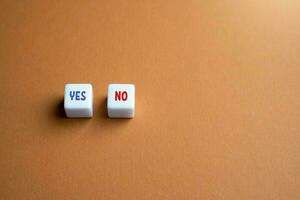 Blocks with yes or no. Choice between acceptance and rejection. Weighing the pros and cons. Symbol of power and responsibility, informed choices. Decision making, voting. photo