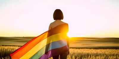 Girl wrapped in pride flag. Concept of LGBT pride. photo