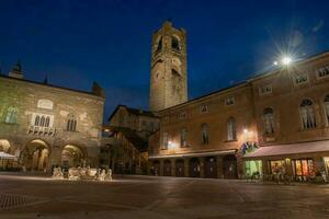 Bergamo old square at dusk photo