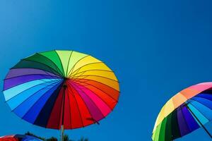 Umbrellas with the colors of the rainbow photo