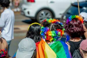 The colorful pride parade in Milan with happy people and to love freely photo