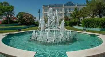 Public fountain in the center photo