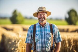 Smiling farmer standing in field , photo