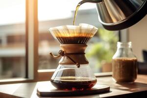 Alternative coffee brewing method,pure over,glass teapot on wooden tray with brewed coffee on dark background. photo