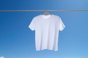 White tshirt mockup on hanger outdoors, photo