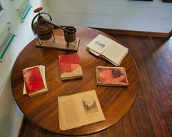 Mahe Seychelles 02.07.2023 Old books inside the small museum inside the colonial house at the takamaka rum distillery, Mahe Seychelles photo