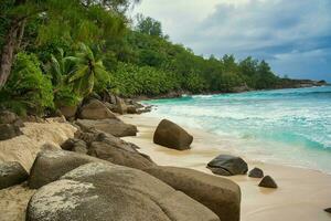 Beautiful rock boulders and white sandy beach of intendance, Mahe Seychelles photo