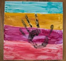 Beautiful painting and hand print by daughter at home photo