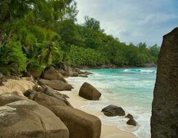 Beautiful rock boulders and white sandy beach of intendance, Mahe Seychelles photo