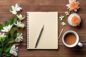 Flat lay blank paper sheet, wooden background, coffee flowers pencil, top view with empty copy space. . photo