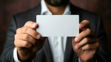 Businessman holding a blank business card, close-up, selective focus. Generative AI. photo