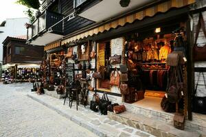 Souvenir leather bags shop in the old town of Nessebar. photo
