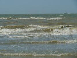 the beach of De Haan at the north sea photo