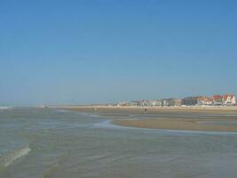 the beach of De Haan at the north sea photo