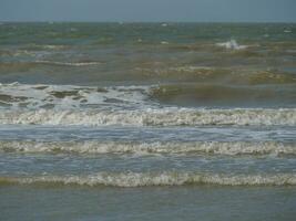 the beach of De Haan at the north sea photo