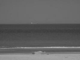 the beach of De Haan at the north sea photo